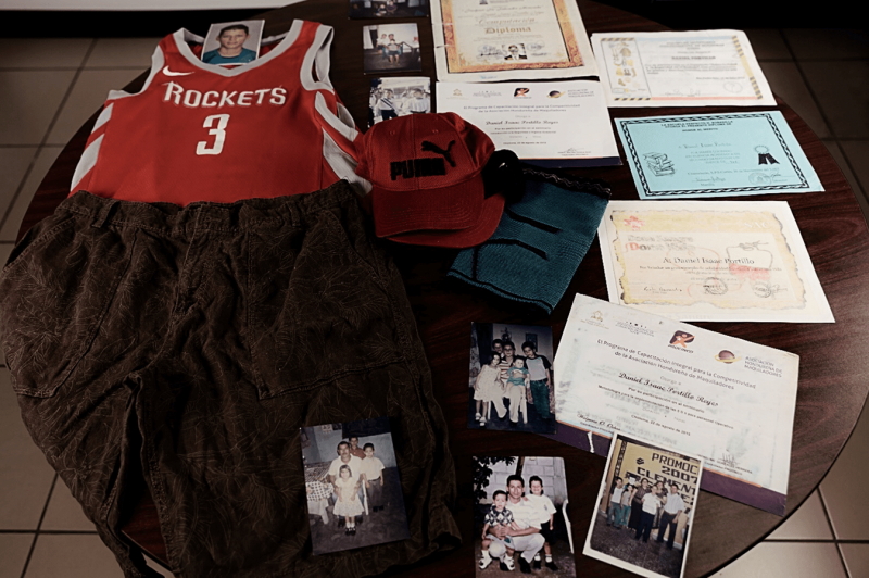 Some of Daniel's personal items, photos and school certificates.